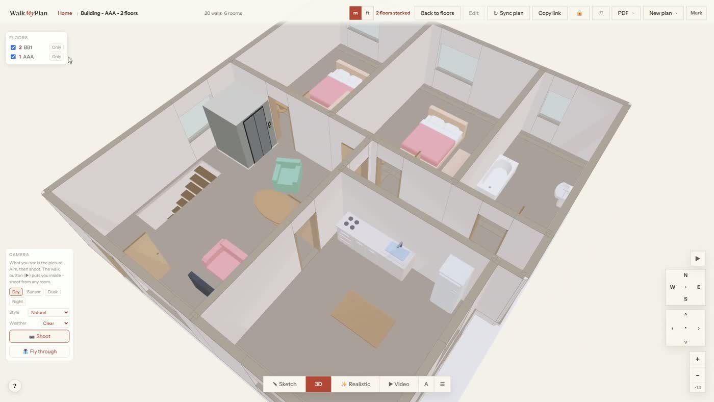 The interior of the stacked two-story home seen from above, showing furnished bedrooms and a living area across both floors
